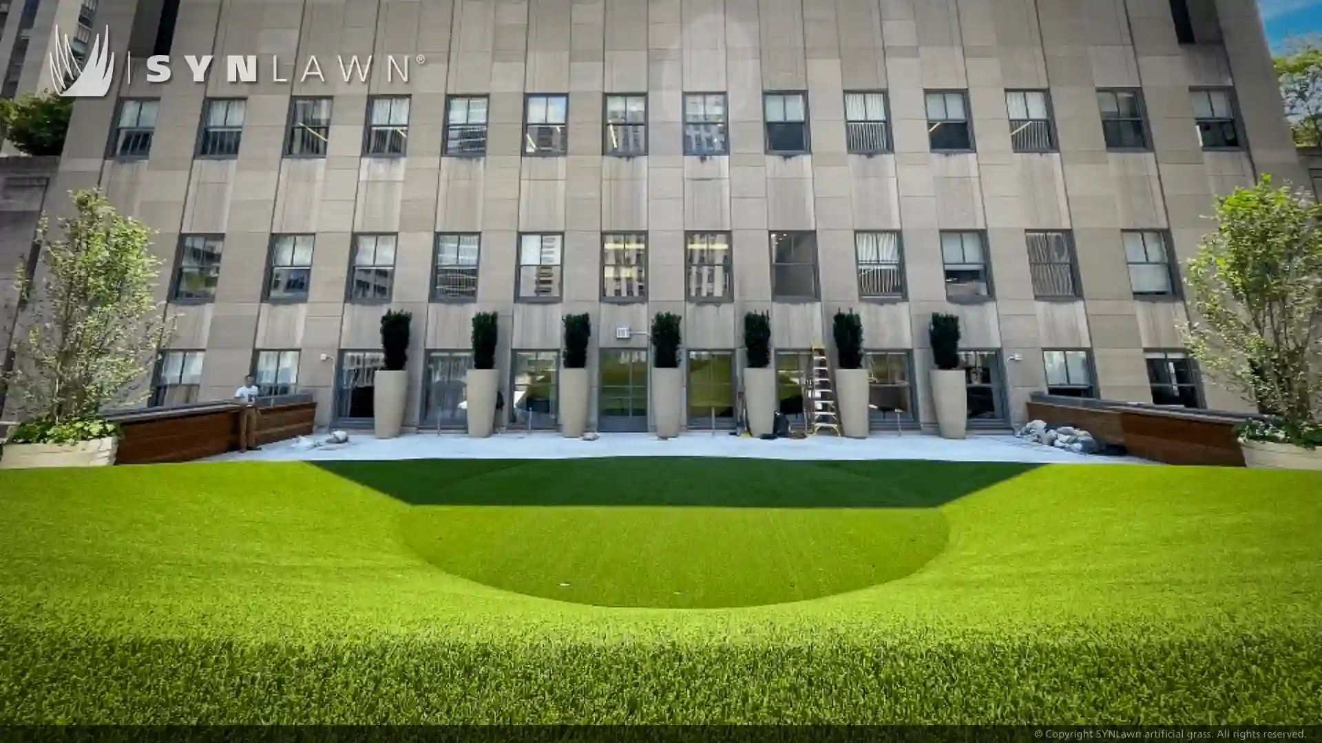 SYNLawn artificial grass at 50 Rockefeller Center Rooftop Art Deco Design image of art deco design using synthetic turf at 50 Rockefeller Center New York City