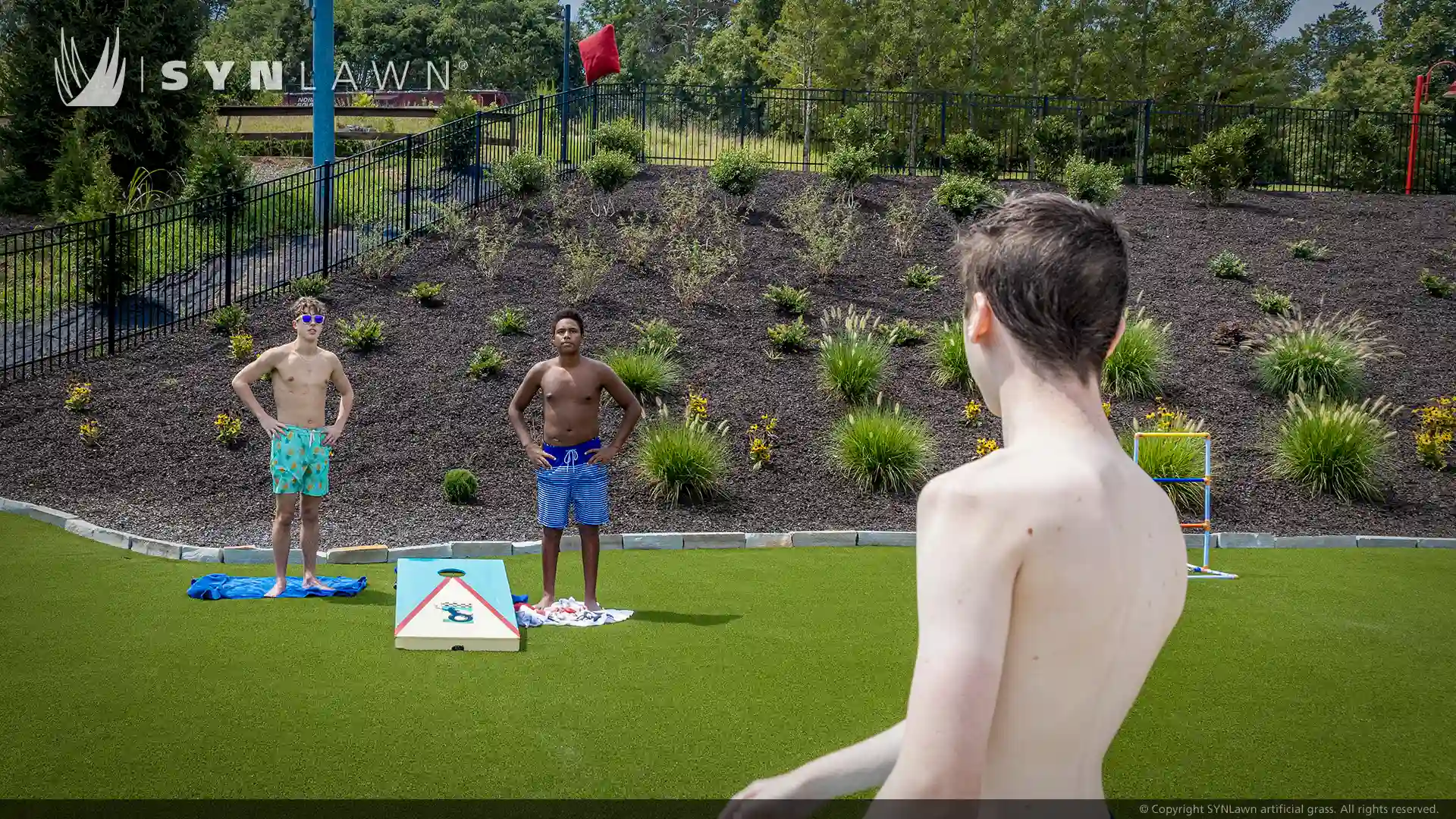 SYNLawn SYNSport artificial grass at Victory Junction Camp and Water Park Randleman North Carolina image of children and teenagers playing on artificial grass at victory junction camp water park North Carolina