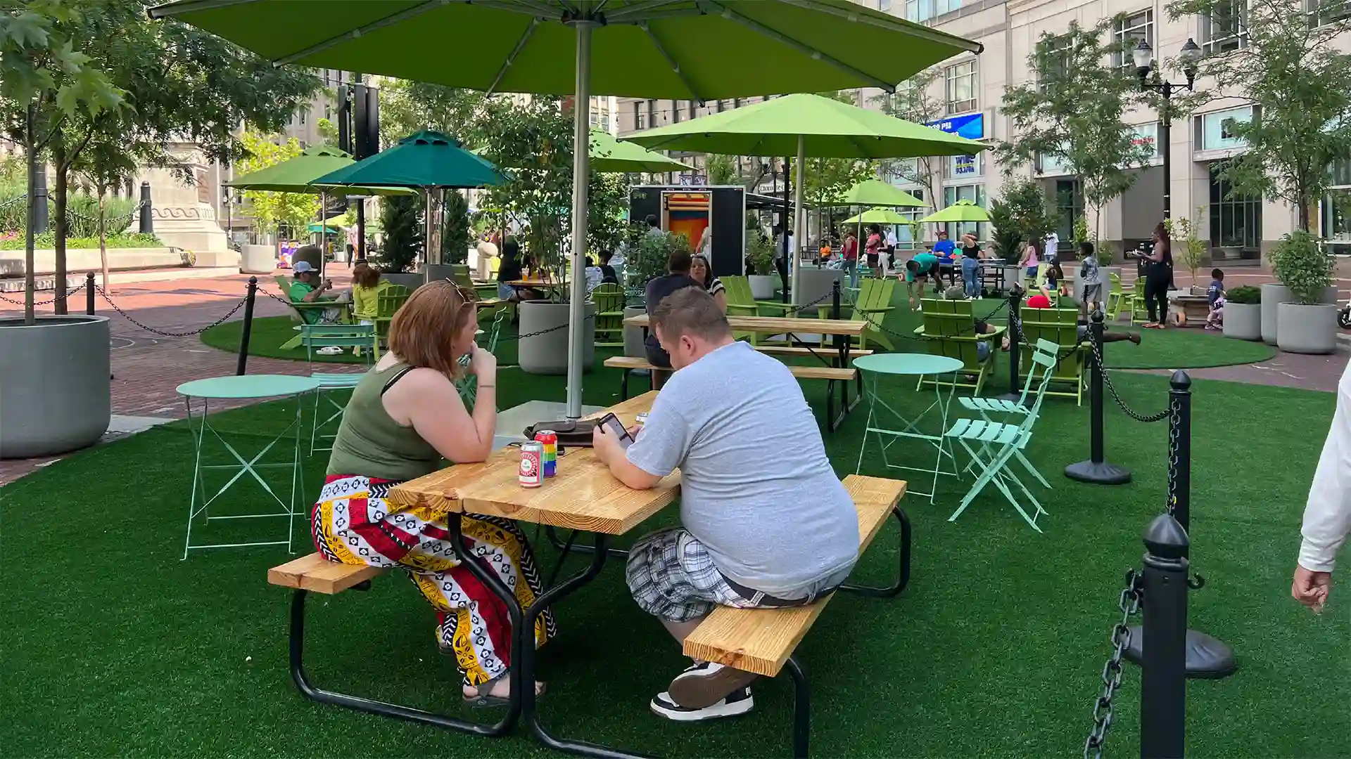 SYNLawn artificial grass at historic Monument Circle Park Indianapolis Indiana image of people enjoying the outdoors on SYNLawn artificial grass at historic Monument Circle Park Indianapolis Indiana
