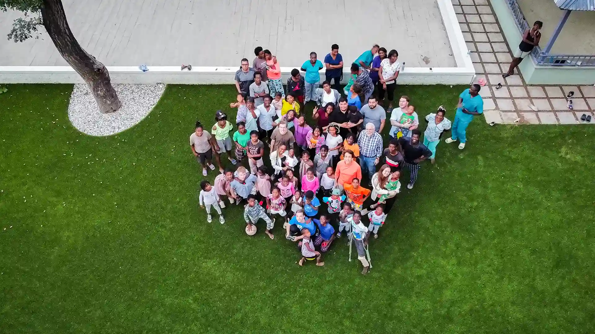 STC Award Winner SYNLawn artificial grass play area at Have Faith Haiti Orphanage image of SYNLawn artificial grass play area at Have Faith Haiti Orphanage